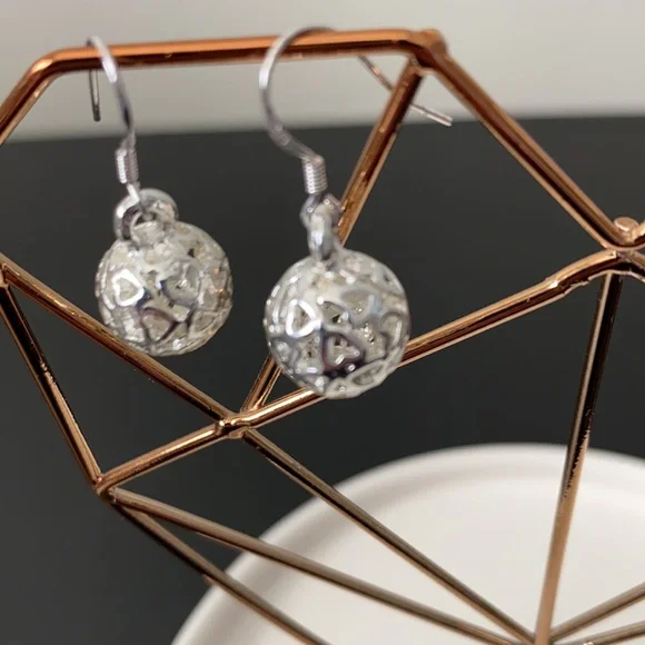 $5 SALE—Silver Hanging Ball with Cut-out Hearts Wire Earrings (not sterling) - Picture 1 of 3